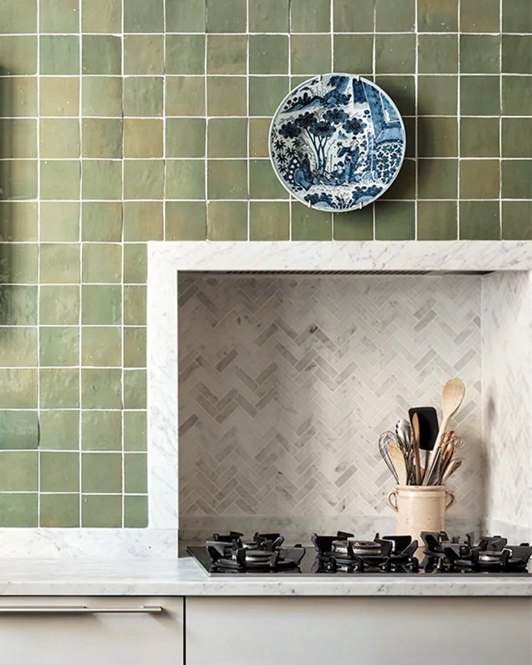 Green kitchen wall with zellige tiles